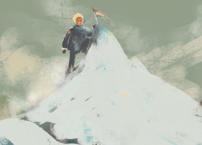 A man plants a flag at the top of a mountain