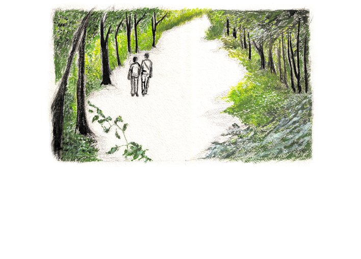 two people walking thorugh the woods