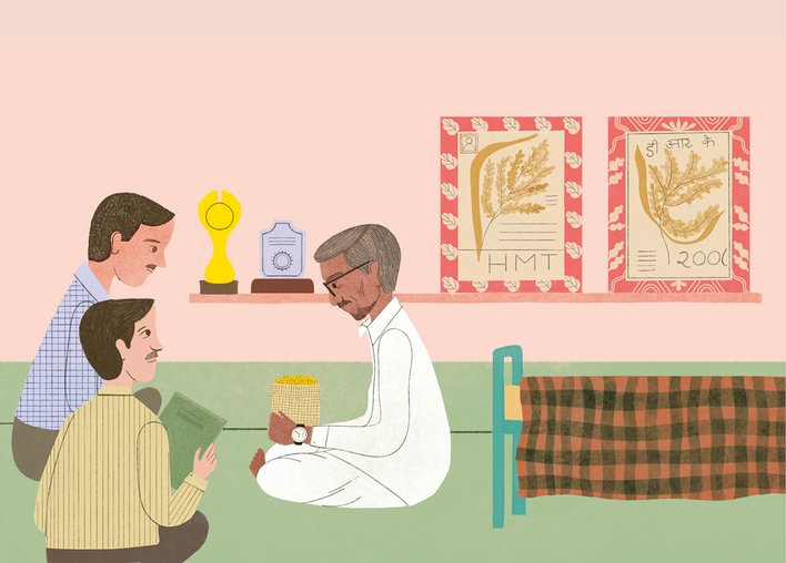 Dadaji Khobragade holding a bag of HMT rice seeds with awards in the background