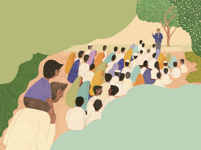 Boy sitting on his father's shoulders among a crowd listening to Babasaheb Ambedkar