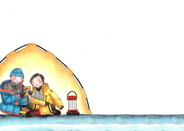 Boy and girl sitting in their tent