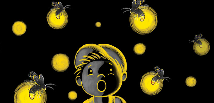 Boy looking with fascination at fireflies glowing at night