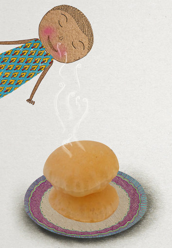 Girl smelling the poori